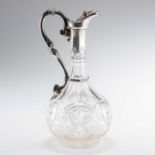 A VICTORIAN SILVER-MOUNTED CLARET JUG