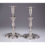 A MATCHED PAIR OF GEORGIAN CAST SILVER CANDLESTICKS