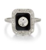 AN ART DECO ONYX AND DIAMOND CLUSTER RING
