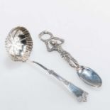 AN EDWARDIAN SILVER SPOON AND A SILVER SIFTING LADLE