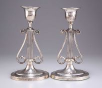 A PAIR OF VICTORIAN SILVER LYRE-FORM CANDLESTICKS