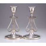 A PAIR OF VICTORIAN SILVER LYRE-FORM CANDLESTICKS