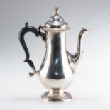 AN EARLY GEORGE III SILVER COFFEE POT