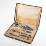 AN ART NOUVEAU SILVER AND ENAMEL MANICURE SET