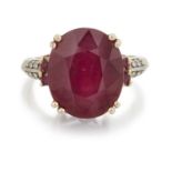 A 9 CARAT GOLD RUBY AND DIAMOND RING