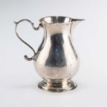 A GEORGE II SILVER SPARROW-BEAK CREAM JUG