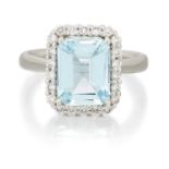 A PLATINUM AQUAMARINE AND DIAMOND CLUSTER RING