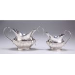 AN EDWARDIAN SILVER CREAM JUG AND SUGAR BOWL