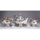 A GEORGE IV SCOTTISH SILVER THREE-PIECE TEA SERVICE