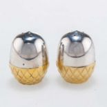 FRANCES LOYEN: A PAIR OF ELIZABETH II SILVER AND PARCEL-GILT PEPPER POTS