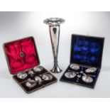 AN EDWARDIAN SILVER VASE AND TWO CASED SILVER CONDIMENT/SALT SETS