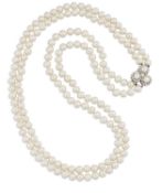 A DOUBLE STRAND CULTURED PEARL NECKLACE WITH A CULTURED PEARL AND DIAMOND CLUSTER CLASP