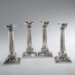 A SET OF FOUR 18TH CENTURY STYLE DUTCH SILVER CORINTHIAN COLUMN CANDLESTICKS