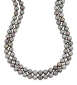 A LONG SINGLE STRAND TAHITIAN CULTURED PEARL NECKLACE