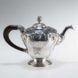 A GEORGE II SILVER PEAR-SHAPED TEAPOT