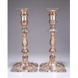 A PAIR OF GEORGE III OLD SHEFFIELD PLATE CANDLESTICKS