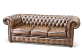 A CHESTERFIELD DEEP-BUTTONED BROWN LEATHER SOFA