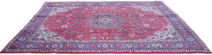 A PERSIAN TABRIZ CARPET