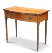 AN EARLY 19TH CENTURY MAHOGANY BOW-FRONT SIDE TABLE