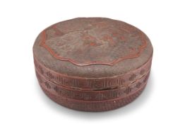 A CHINESE CINNABAR LACQUER CIRCULAR BOX AND COVER