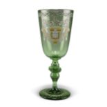 AN ARMORIAL GREEN GLASS GOBLET, CIRCA 1890