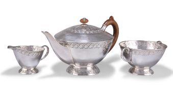 AN ARTS AND CRAFTS SILVER THREE-PIECE TEA SERVICE