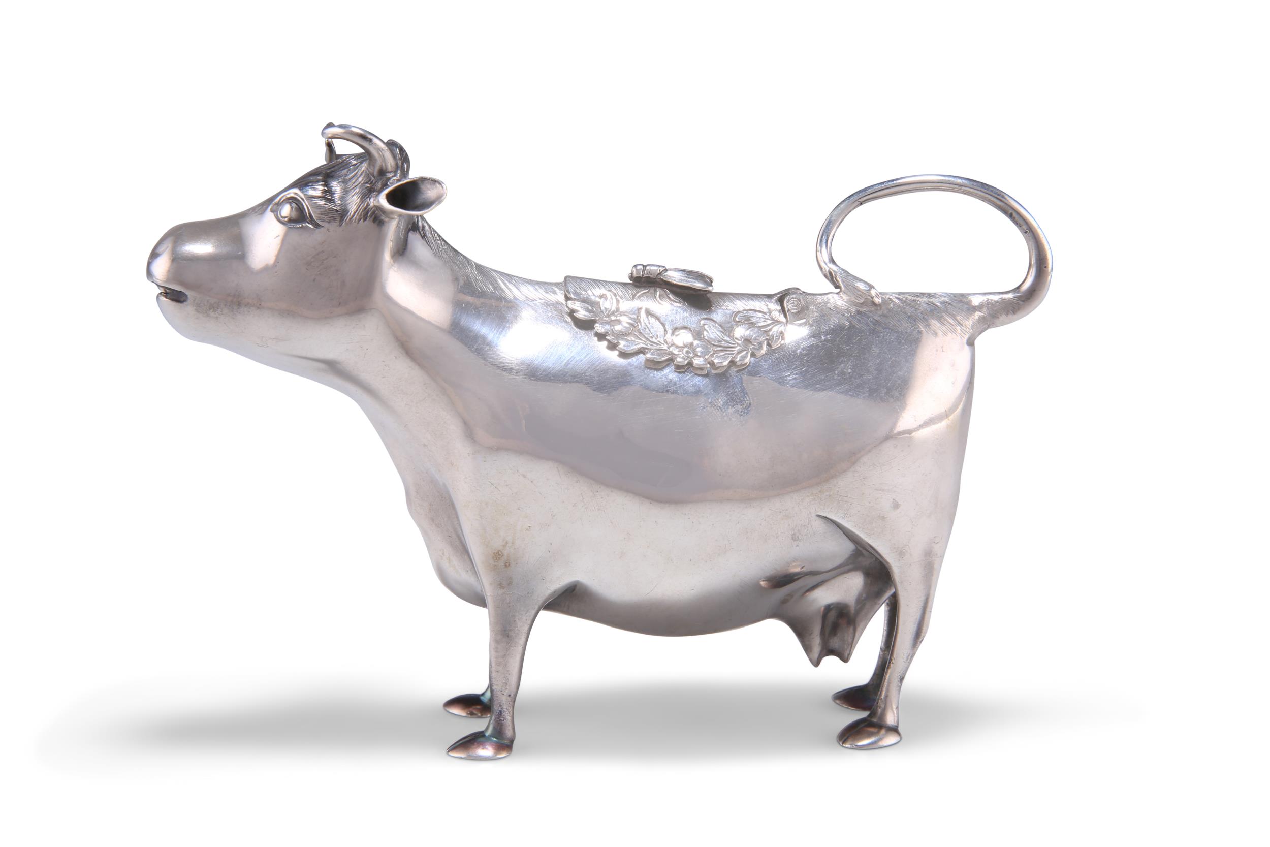 A GEORGE III SILVER COW CREAMER