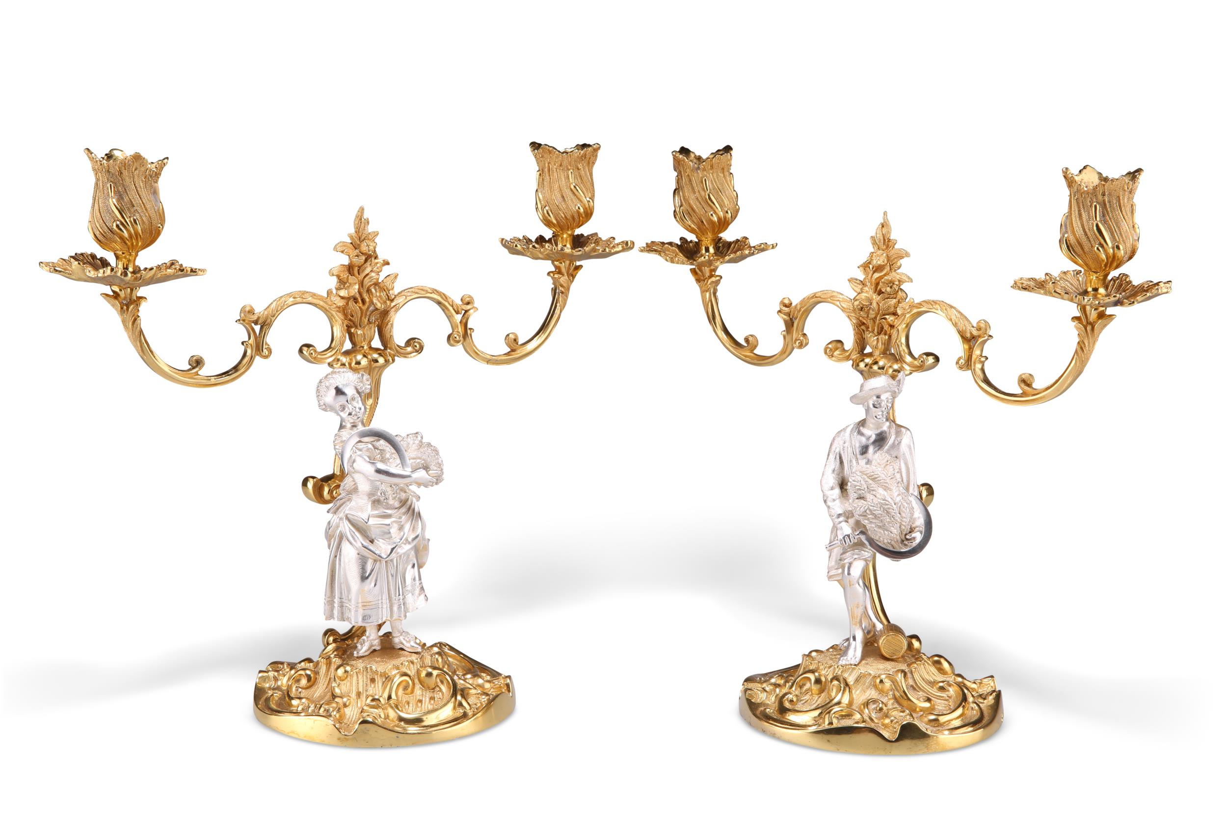 A PAIR OF ROCOCO REVIVAL PARCEL-GILT SILVER CANDELABRA