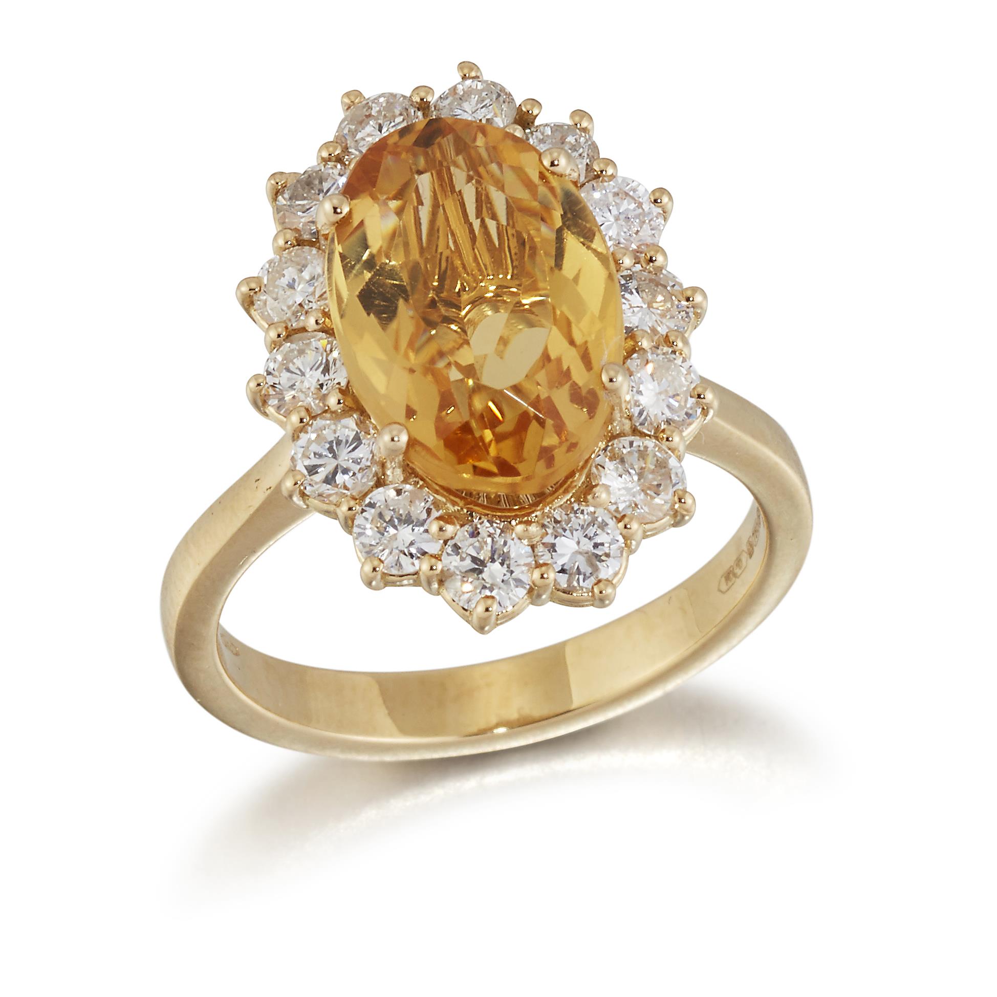 AN 18 CARAT GOLD CITRINE AND DIAMOND CLUSTER RING