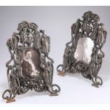 A PAIR OF ORNATE VICTORIAN COPPER EASEL PHOTOGRAPH FRAMES