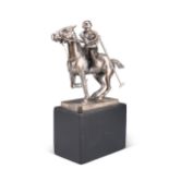 A CHROME-PLATED FIGURE OF A POLO PLAYER ON HORSEBACK