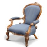 A VICTORIAN WALNUT AND UPHOLSTERED ARMCHAIR