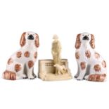 A TURN VIENNA FIGURAL VASE AND A PAIR OF STAFFORDSHIRE SPANIELS