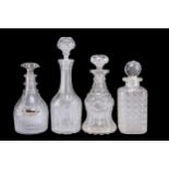 A GROUP OF FOUR GEORGIAN AND LATER GLASS DECANTERS