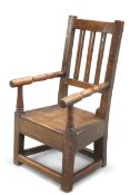 AN OAK CHILD'S ELBOW CHAIR, CIRCA 1800