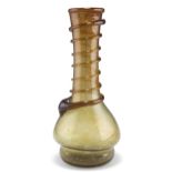 AN OLIVE GREEN LONG-NECK GLASS JUG, MID 18TH CENTURY