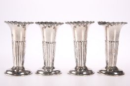 A SET OF FOUR PART FLUTED POSY VASES