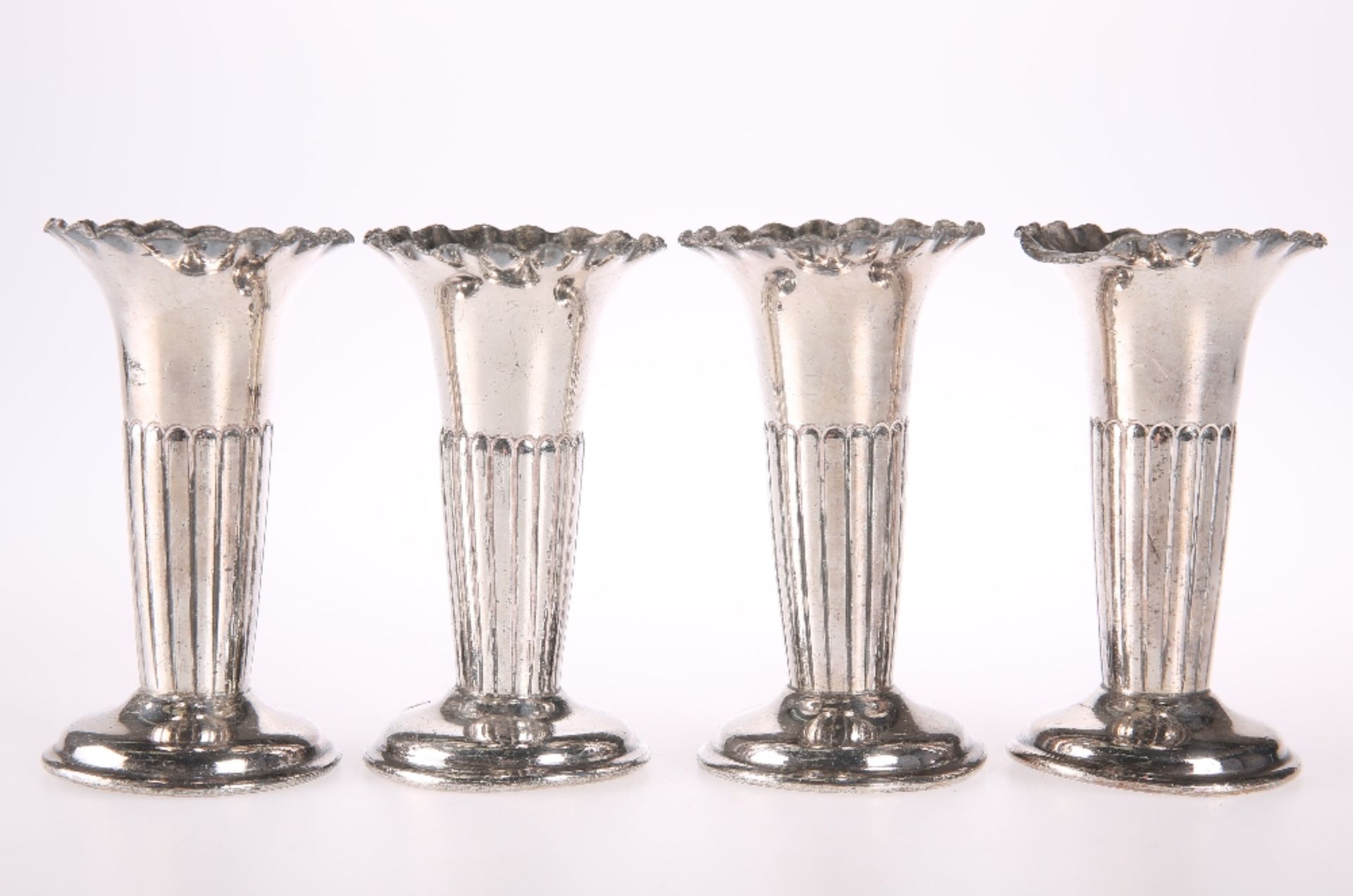 A SET OF FOUR PART FLUTED POSY VASES