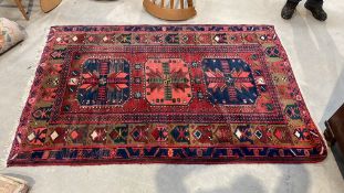 A Persian Hamadan rug. 213cm by 139cm