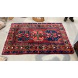 A Persian Hamadan rug. 213cm by 139cm