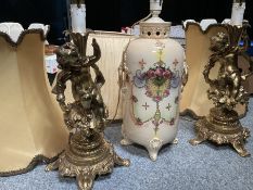 A PAIR OF GILT-METAL FIGURAL TABLE LAMPS AND AN EDWARDIAN POTTERY TABLE LAMP