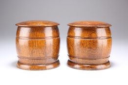 A PAIR OF OAK TOBACCO JARS, CIRCA 1950