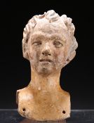 A TERRACOTTA HEAD OF A LADY