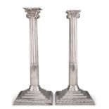 A PAIR OF GEORGE III SILVER CANDLESTICKS