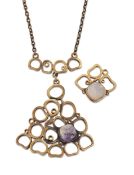 PENTTI SARPANEVA - A FINNISH BRONZE AND AMETHYST PENDANT NECKLACE AND RING SET