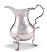 A GEORGE III SILVER CREAM JUG