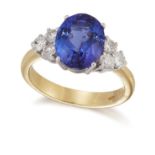 AN 18 CARAT GOLD TANZANITE AND DIAMOND RING