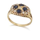 AN 18 CARAT GOLD SAPPHIRE AND DIAMOND CLUSTER RING