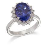 A TANZANITE AND DIAMOND CLUSTER RING