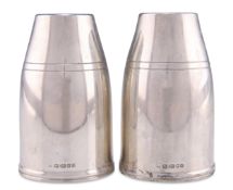 A PAIR OF MODERNIST SILVER SALT AND PEPPER POTS